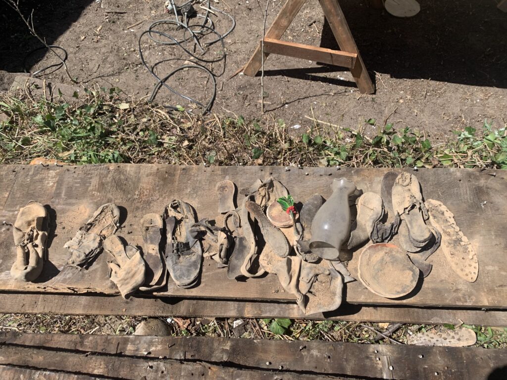 A collection of shoes from the early 1800s from the Teen Center building.